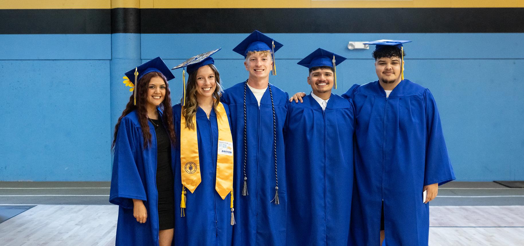 Barton graduates smile for a photo during commencement 2026